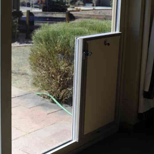Sliding glass patio dog door